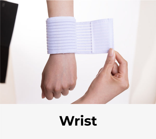 woman wrapping compression band around wrist